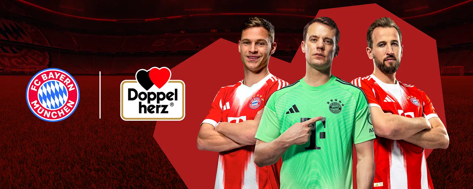 Three football players stand together, representing FC Bayern Munich. They wear the team's distinctive red and white uniforms, with one in a green goalkeeper jersey. The image also includes the FC Bayern logo and a logo for Doppelherz, a brand associated with health products. The background is a football stadium.